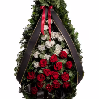Coroană funerară cu garoafe albe și trandafiri roșii